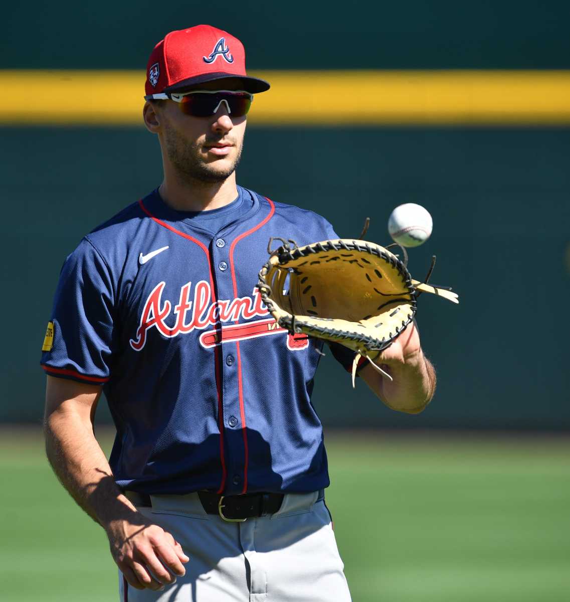 Atlanta Braves infielder Matt Olson (#28) warms up at the start of practice Tuesday, Feb. 20, 2024 at CoolToday Park in North Port, Florida.  